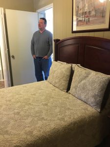 Chuck standing in guest room