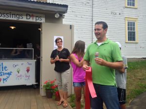 People standing in front of ice cream parlor