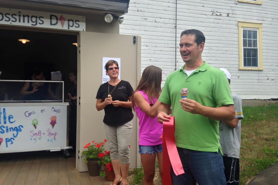 People standing in front of ice cream parlor