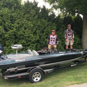 Guys standing on boat