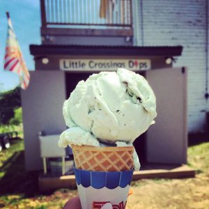 Ice cream cone in front of ice cream parlor