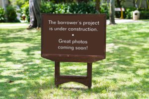 Sign stating the borrower's project is under construction