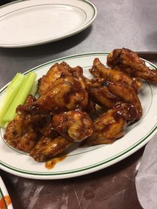 Plate of chicken wings with celery