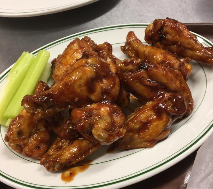 Plate of chicken wings with celery
