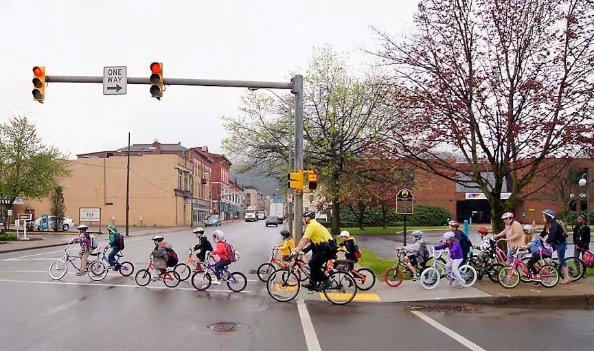 Cyclists riding across street