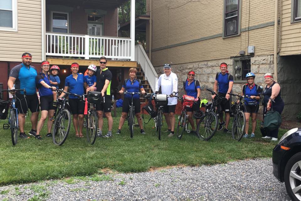 Guest cyclists standing in front of Inn on Decatur